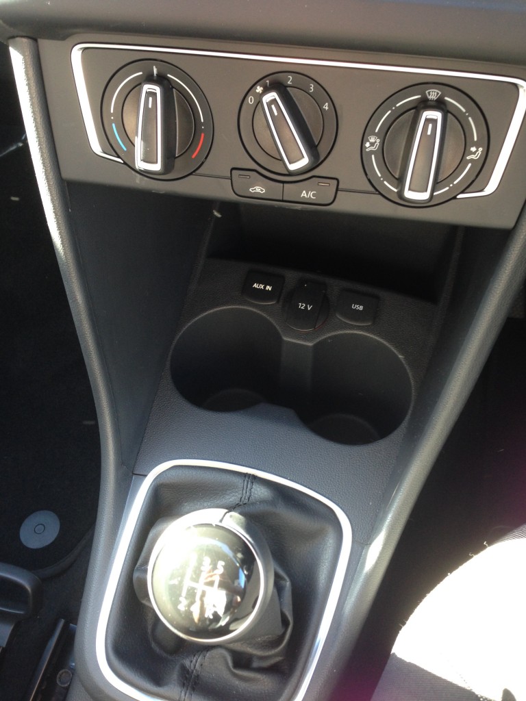 Auxiliary inputs and dual cup holders