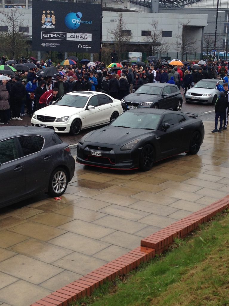 Matte Black Nissan GTR and a White Mercedes C63 AMG Saloon