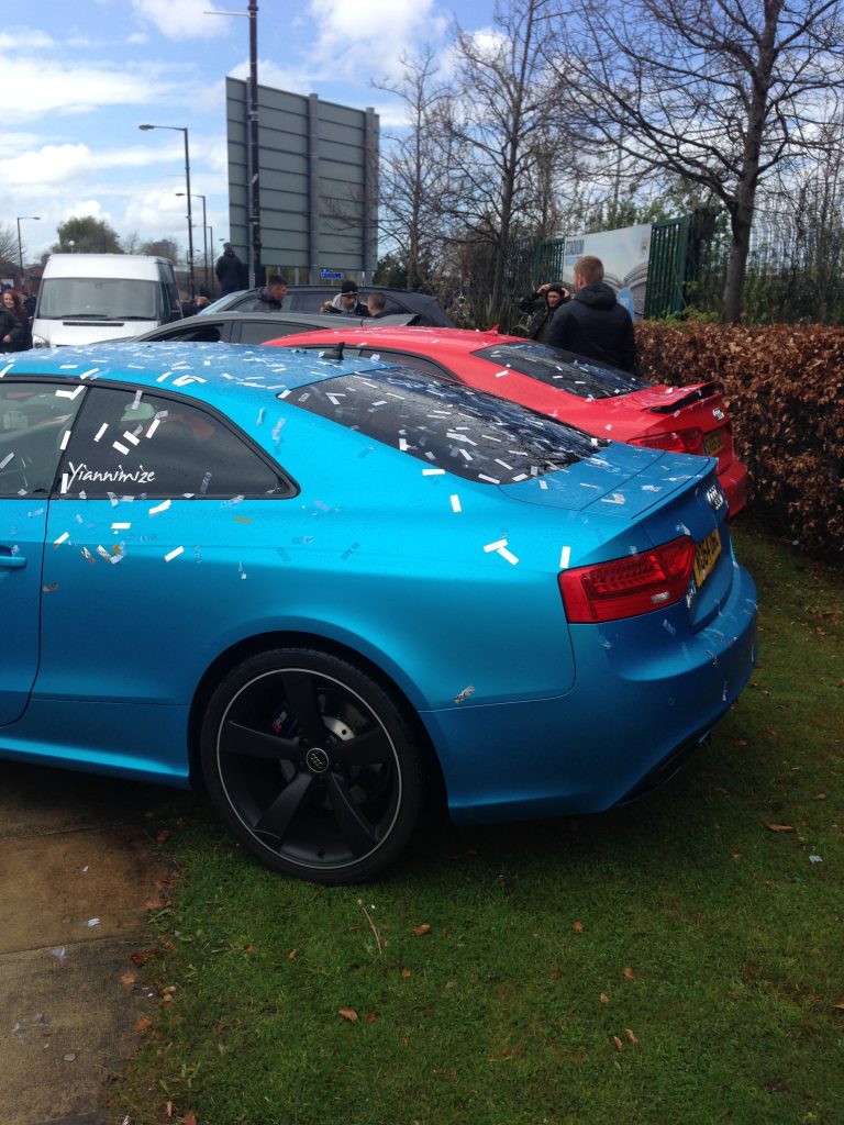 Pale blue Audi RS7 next to a red Audi RS7